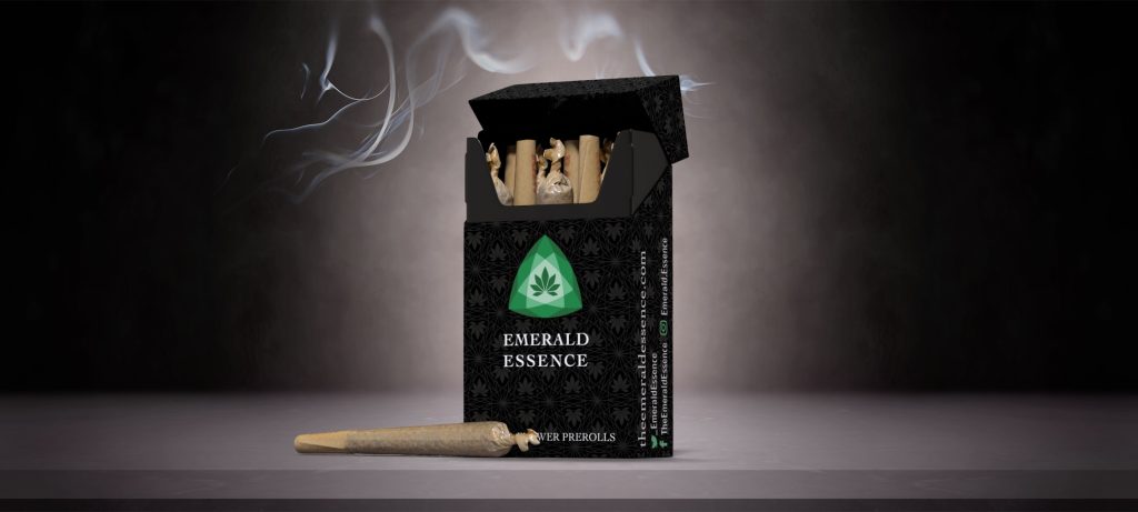 A pack of cannabis prerolls with with a gray all over geometric pattern and stylized green emerald logo of Emerald Essence